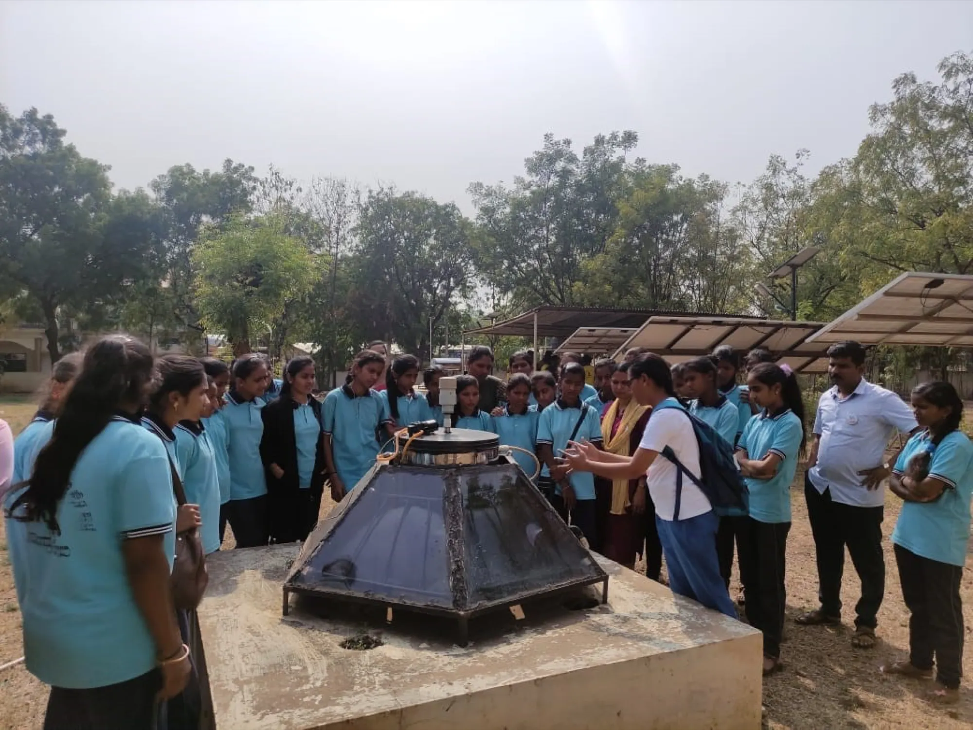 Students on a field visit to a solar-thermal installation