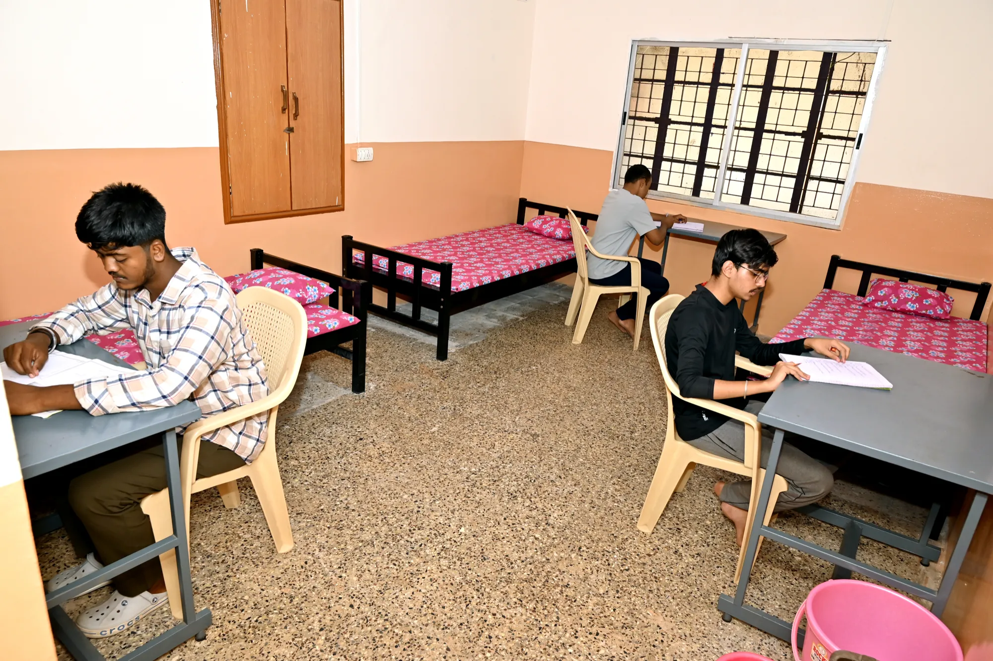 Students studying in a Sir M. Visvesavaraya Block hostel room at Basaveshwar Engineering College