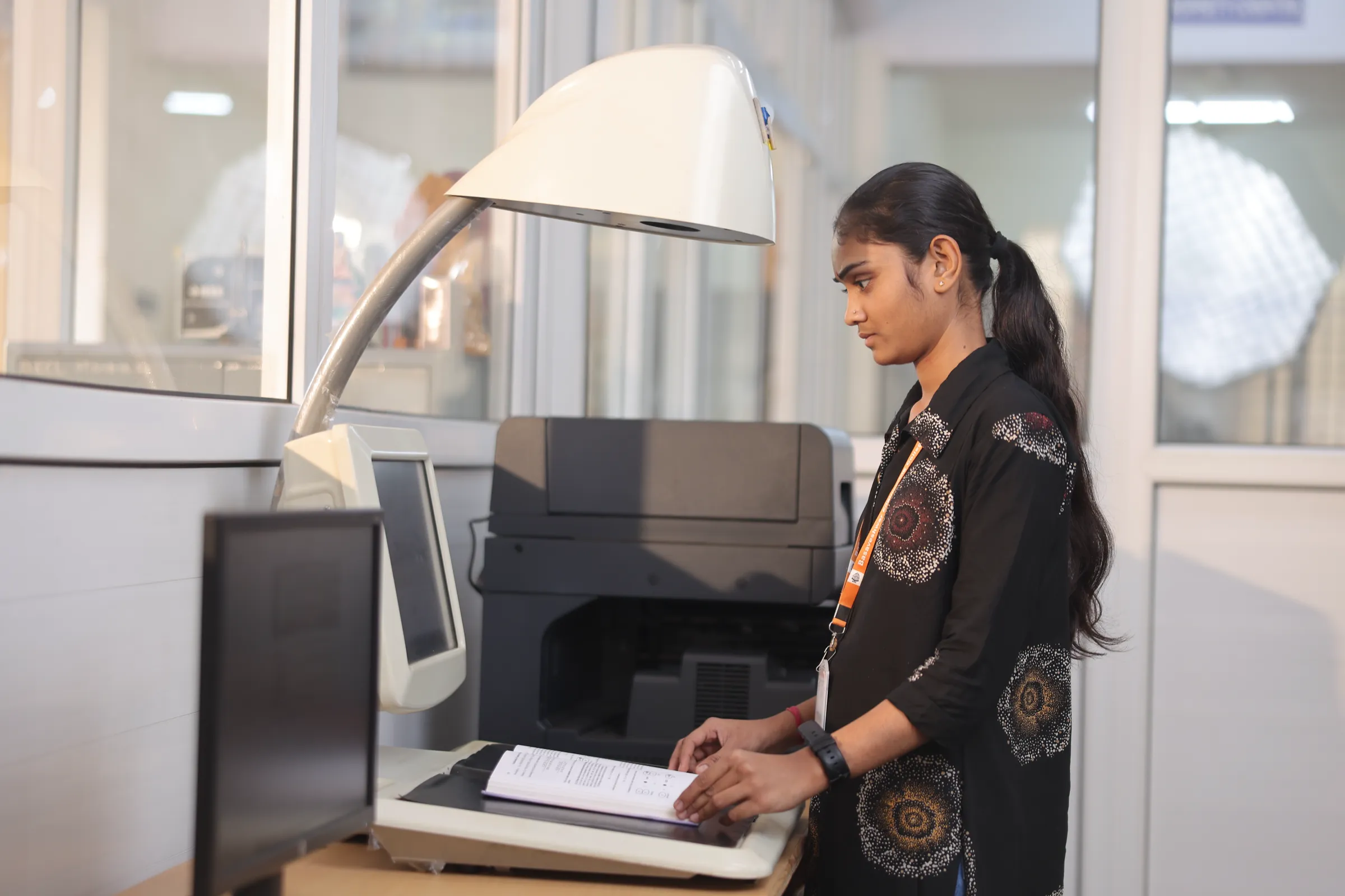 Student using the book scanning station