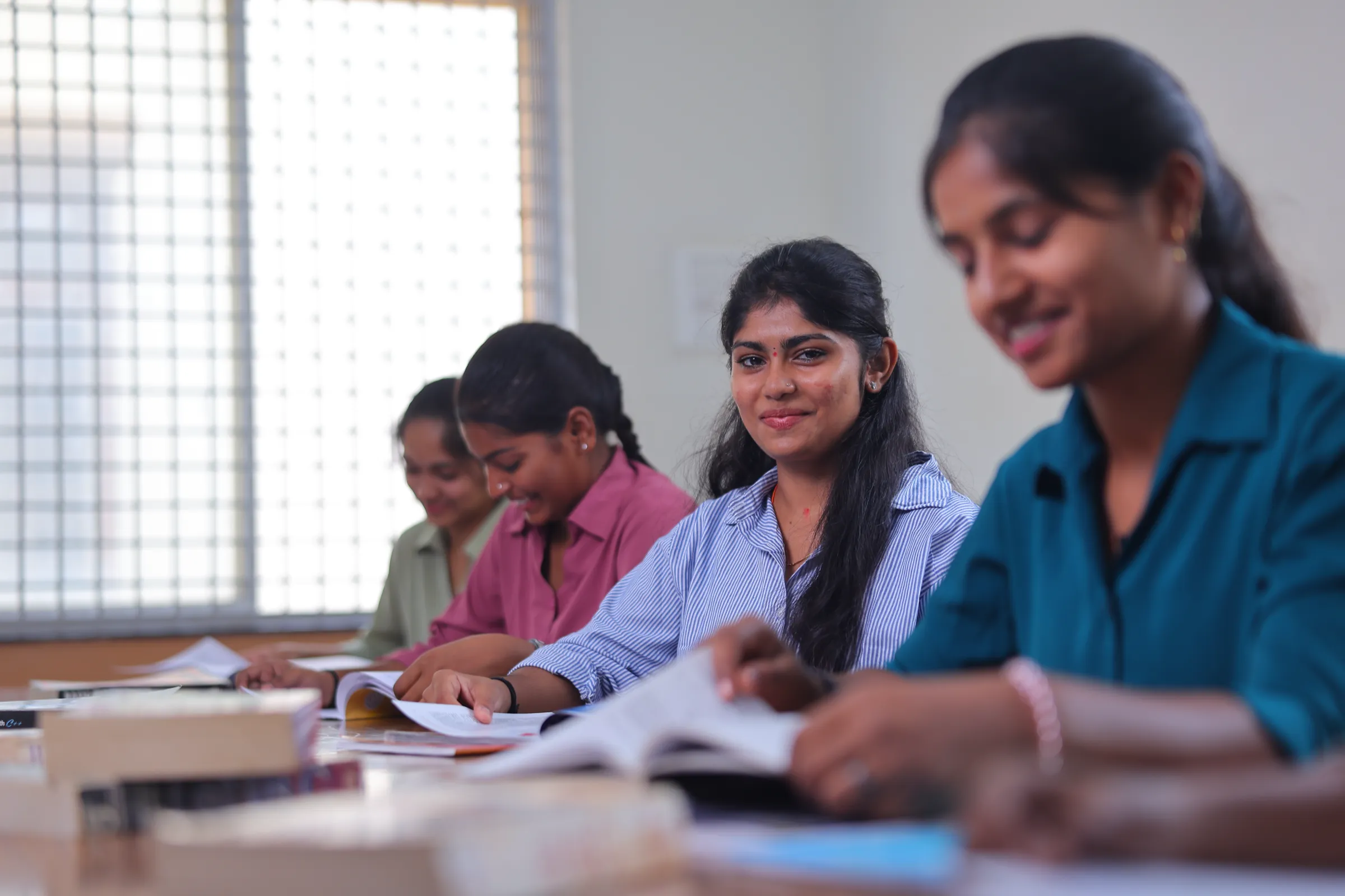 Students reading at a library table