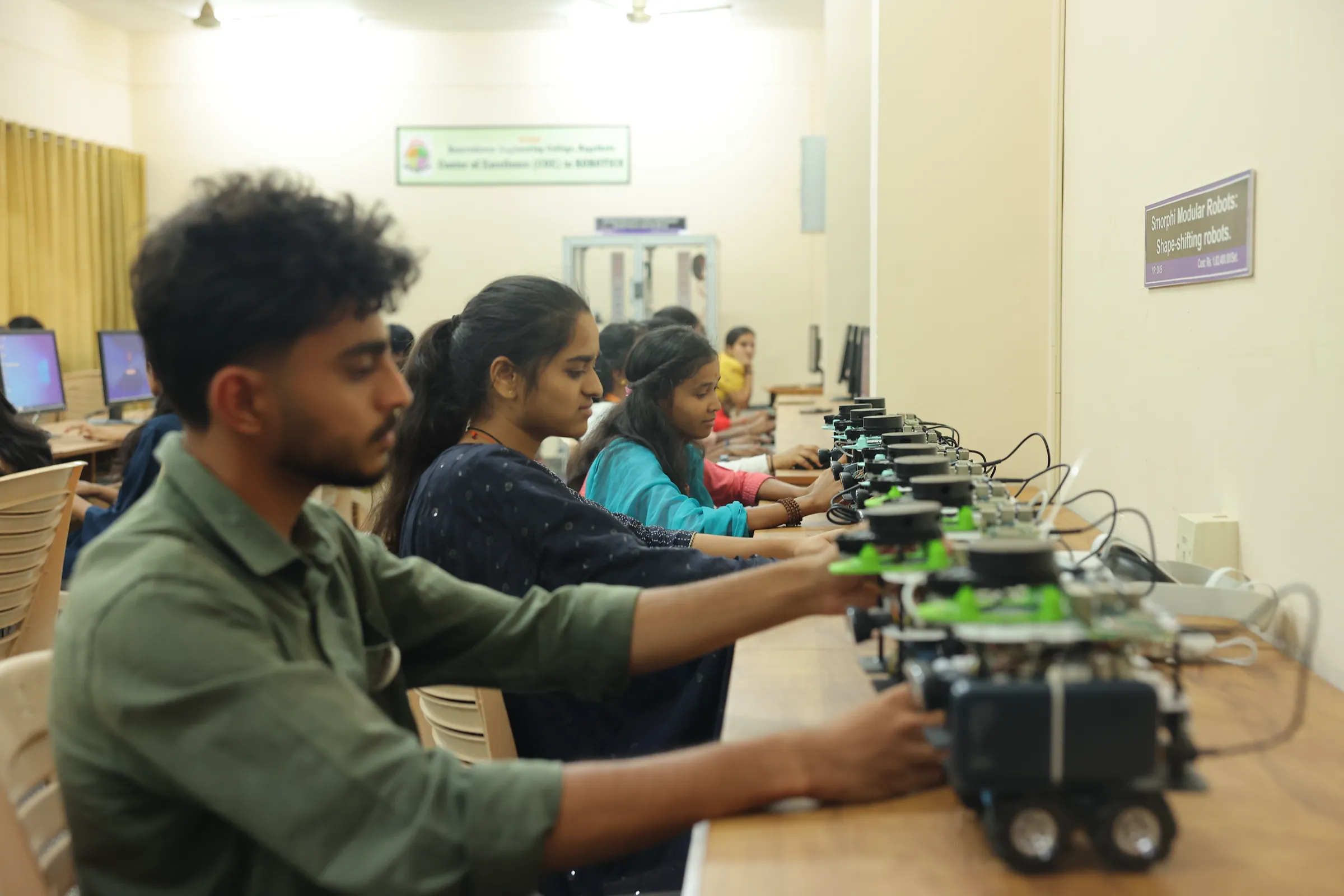 Students programming autonomous mobile robots in the lab