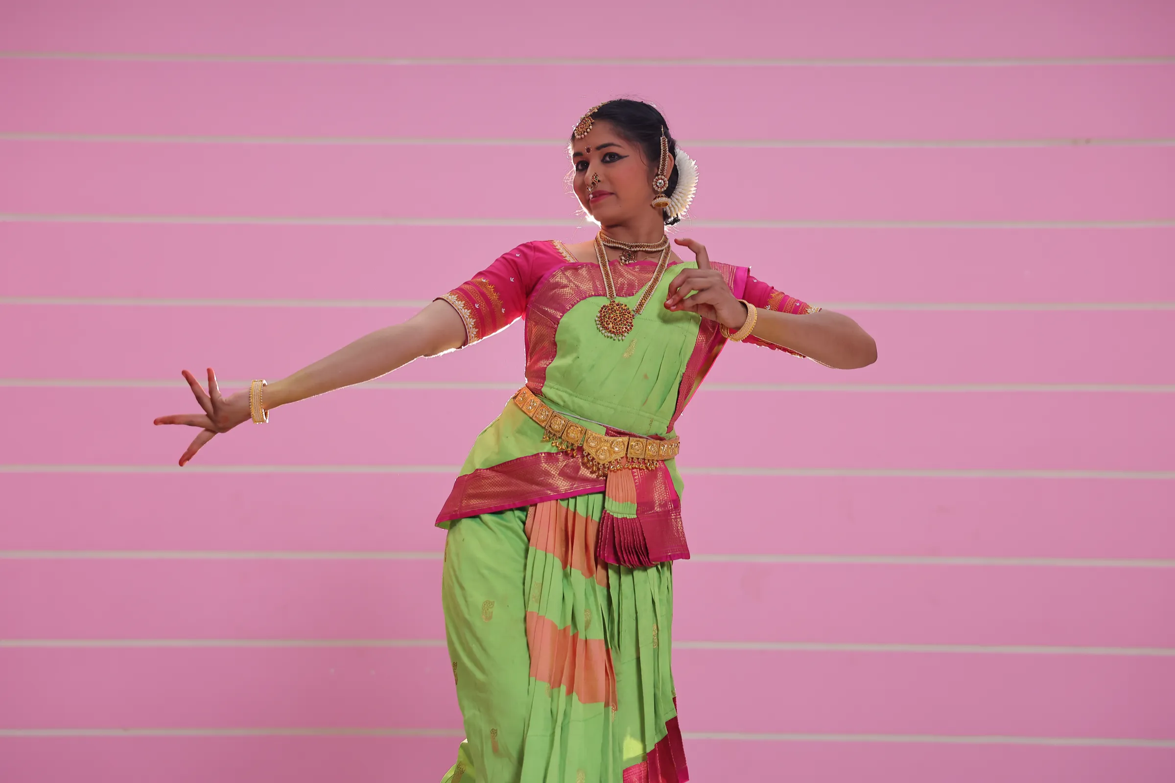 Student performing a classical dance at a BEC cultural event